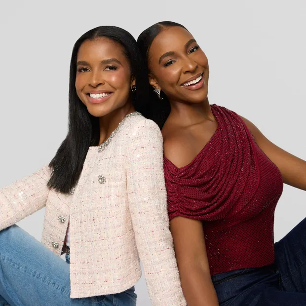 Justice and Nia Faith back to back, smiling at the camera